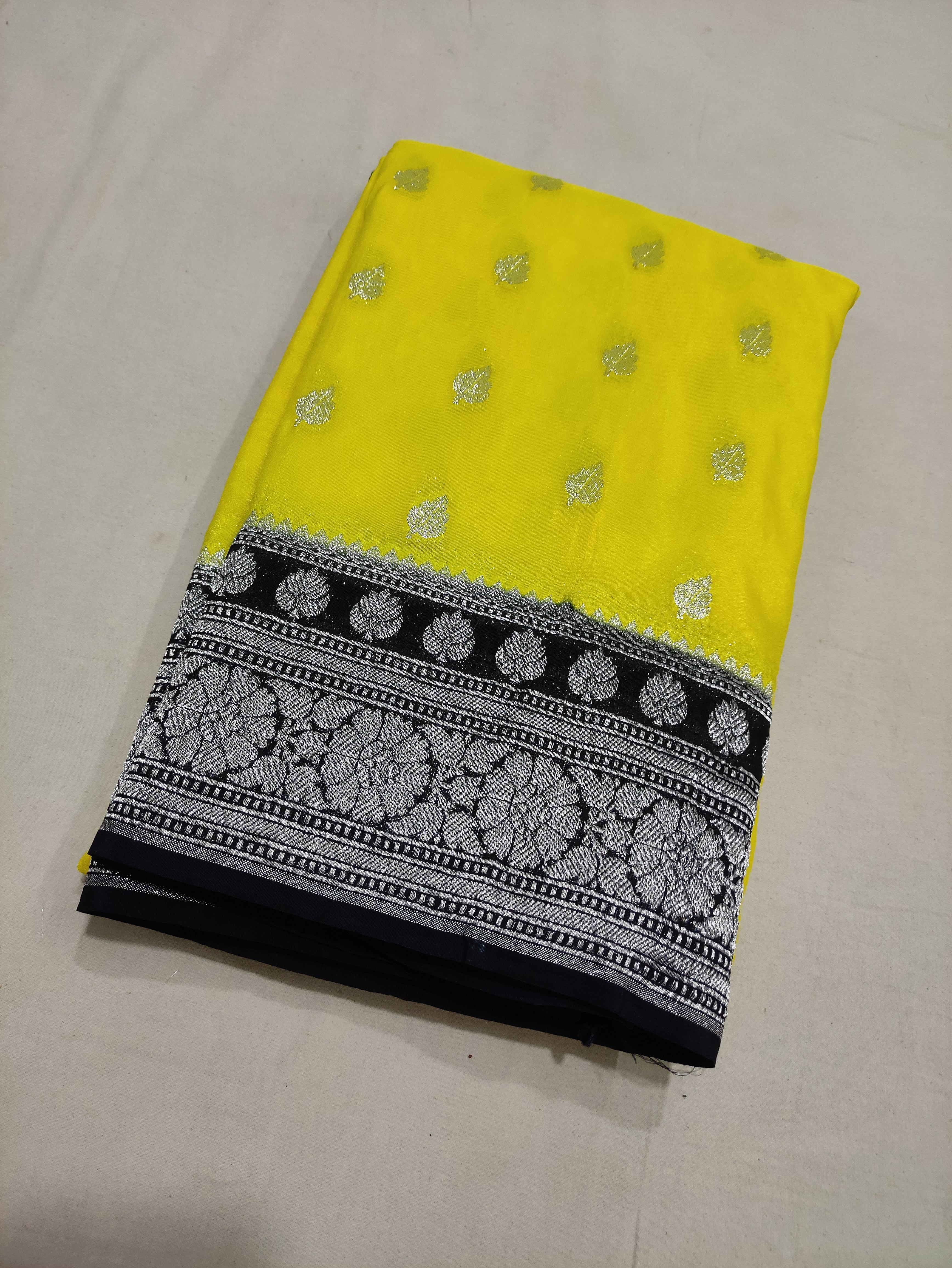 Lemon And Black Colour Zari Buti Georgette Saree