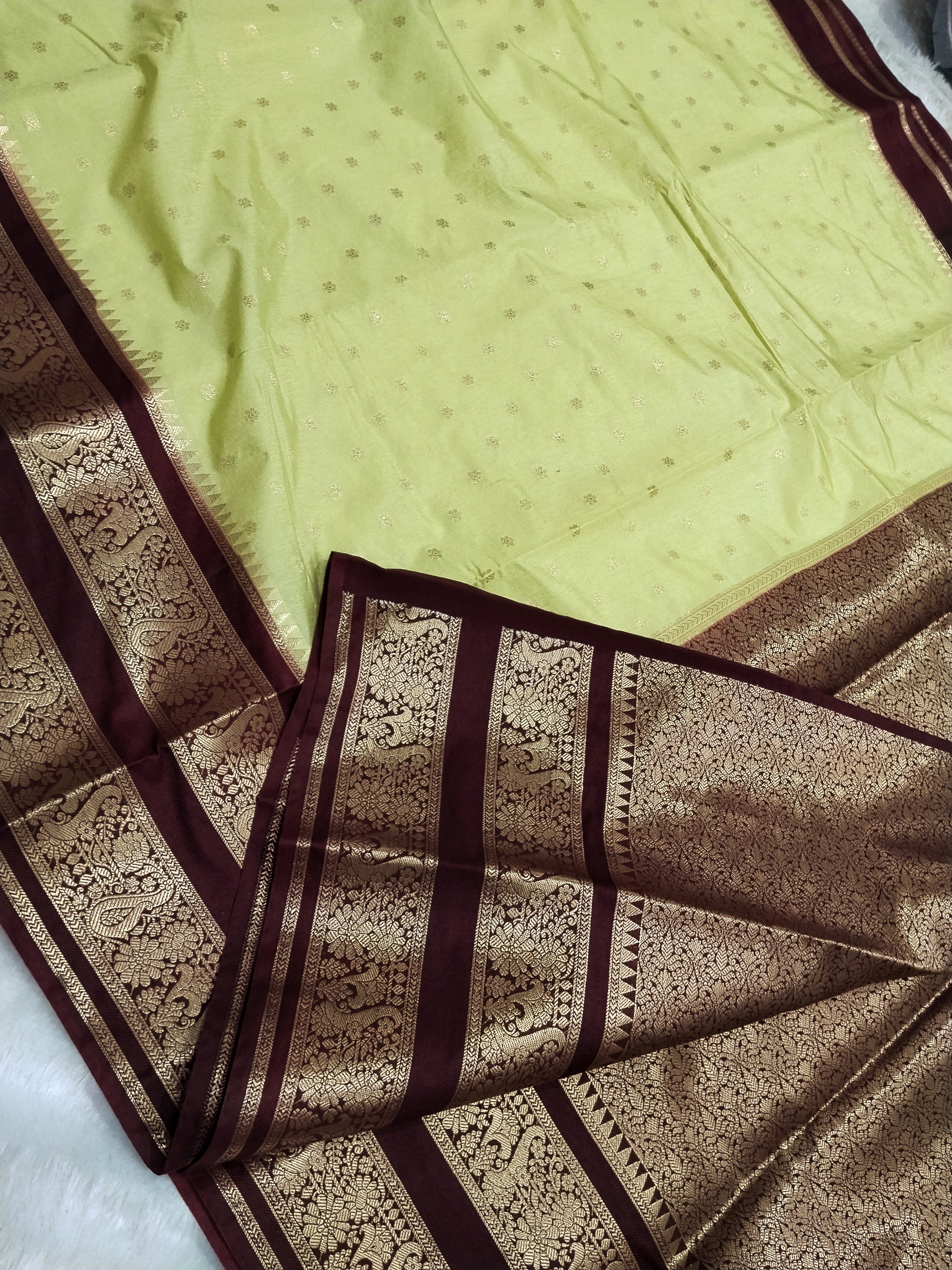 Pista Green And Brown Colour Kanjivaram Border Moonga Silk Saree With Buti Work