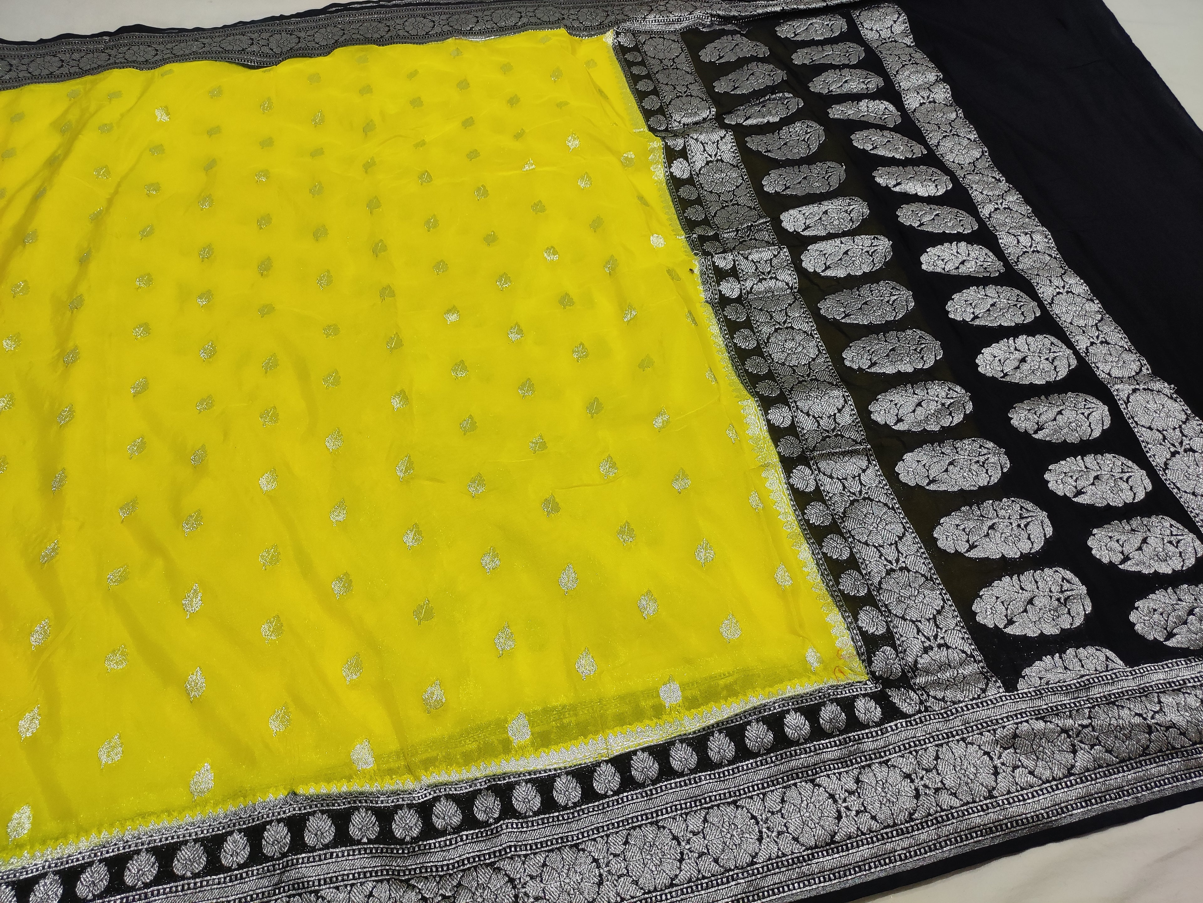 Lemon And Black Colour Zari Buti Georgette Saree