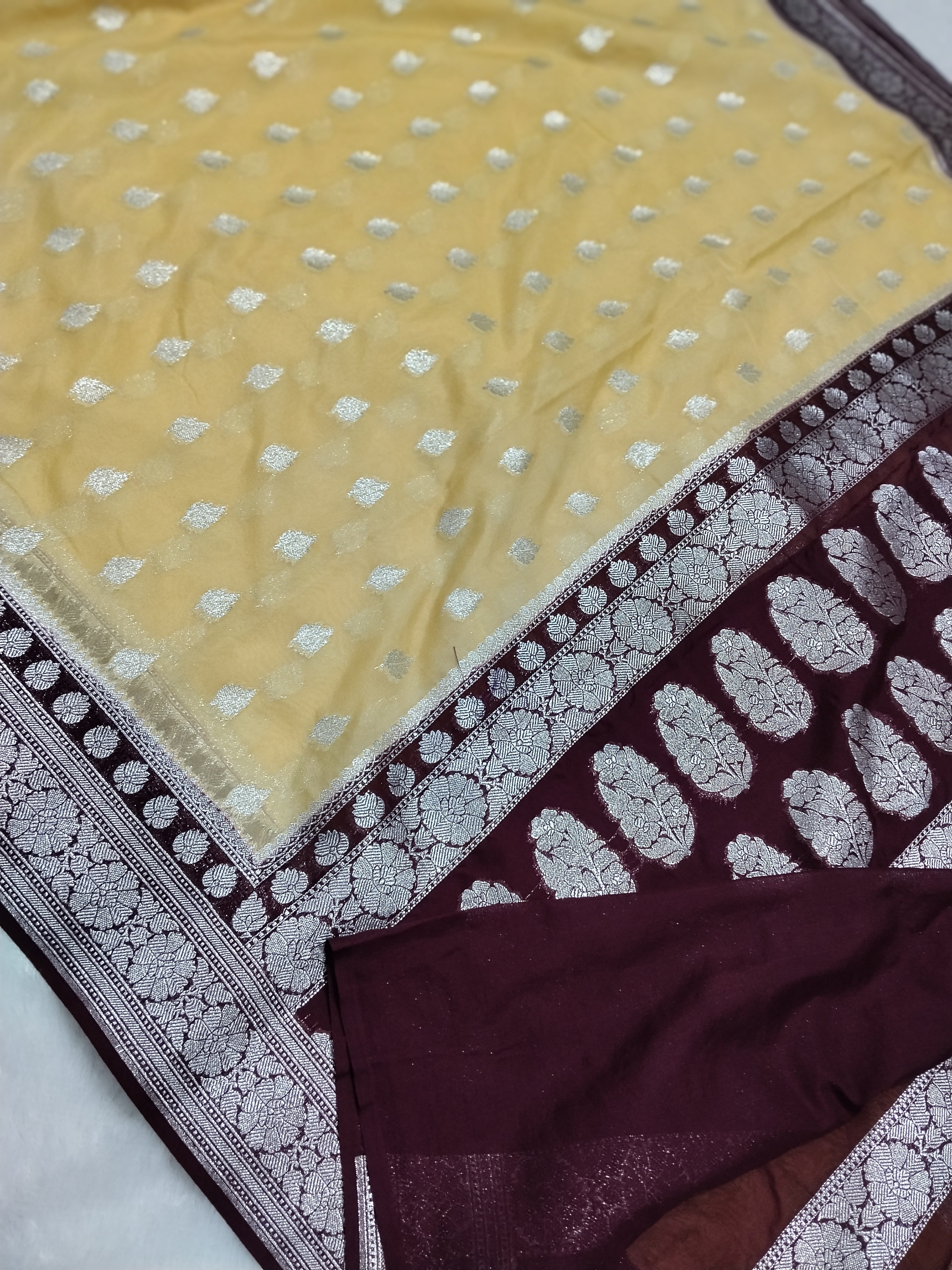 Light Lemon And Dark Brown Colour Banarasi Khaddi Georgette Saree